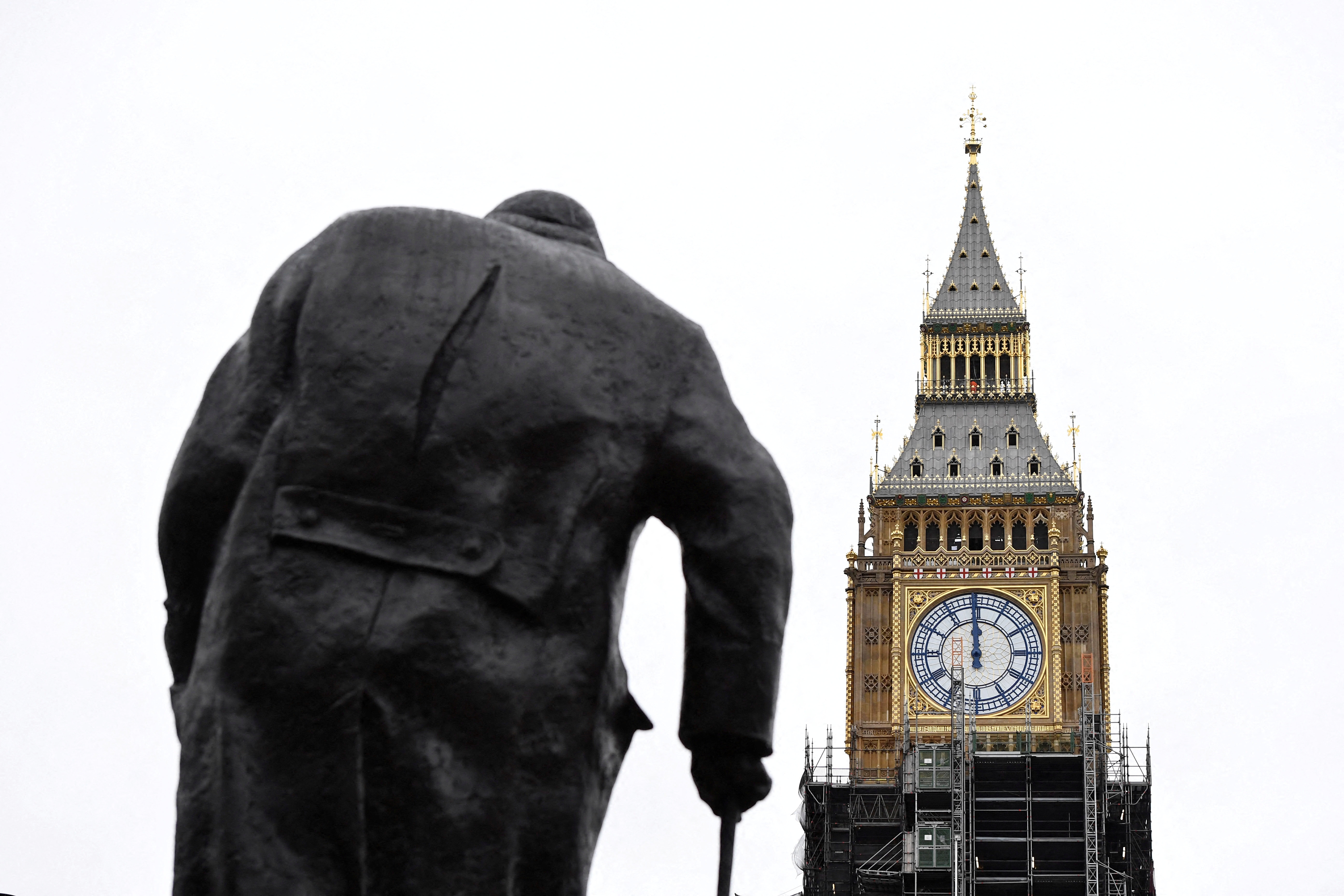 Big Ben clock face shows midday, ahead of New Year's Eve events when all four faces will be visible for the first time to ring in the new year since restoration works commenced at Houses of Parliament in London