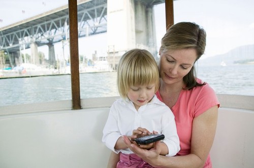 Mom and Daughter With Blackberry Device Small Commuter Ferry G