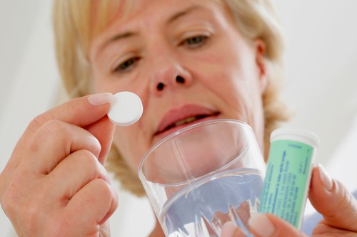 ELDERLY PERSON WITH ASPIRIN