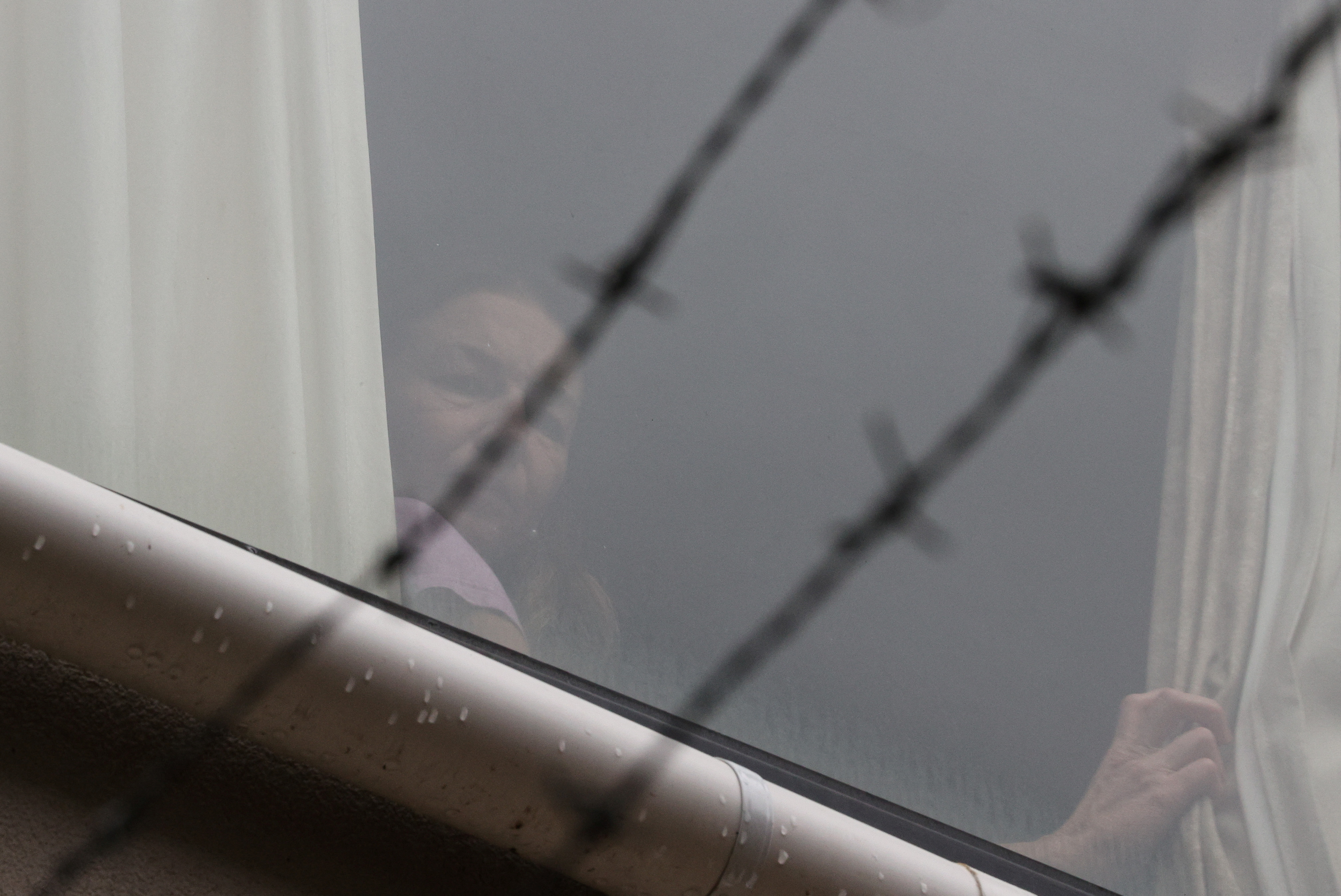 renata voračova, Tennis player Renata Voracova looks out a window from the Park Hotel in Melbourne