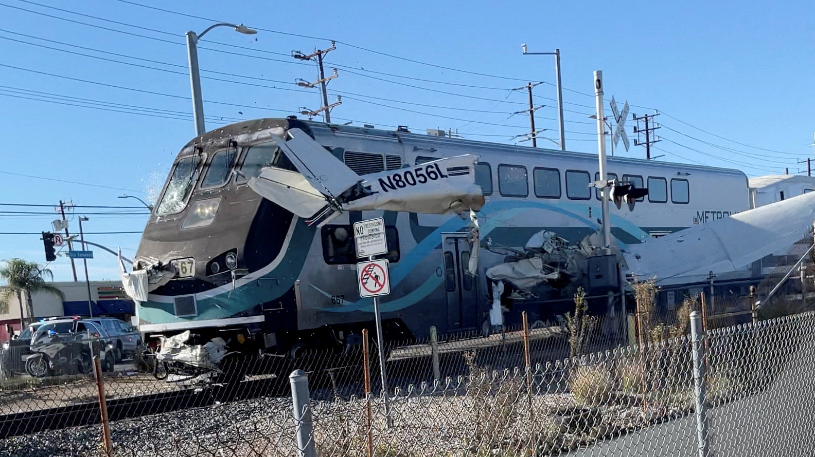 A train hits an aircraft that crashed on railway tracks in Los Angeles
