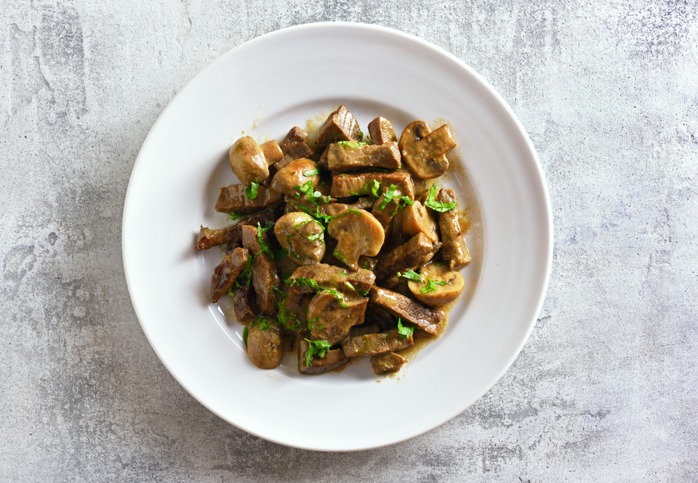 Delicious,Beef,Stroganoff,With,Mushrooms,On,Plate,Over,Stone,Background.