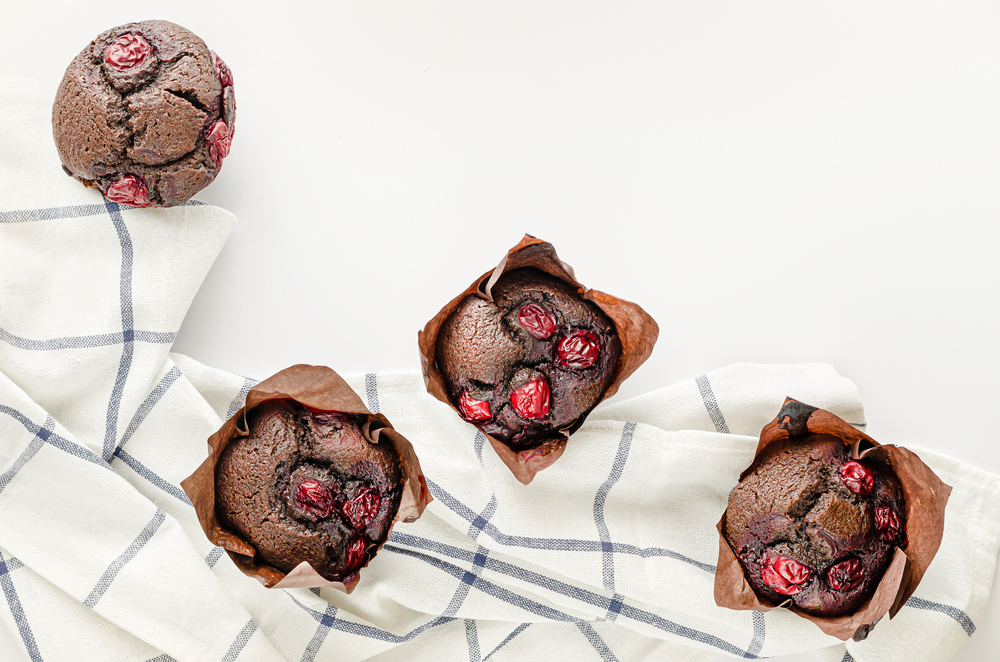 Chocolate,Cupcakes,Or,Muffins,With,Cherries.,Overhead,,Copy,Space.