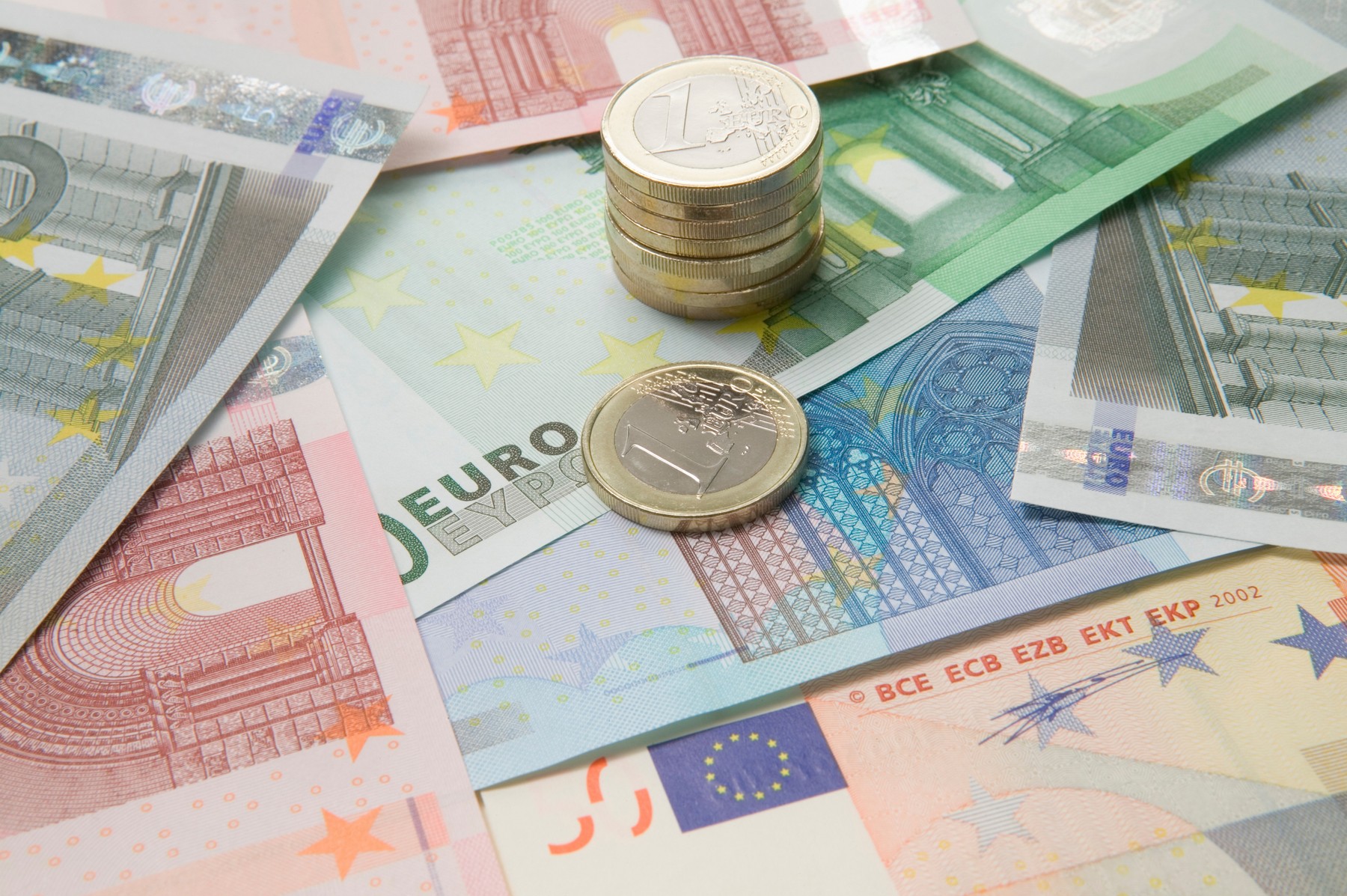Euro currency and a stack of coins