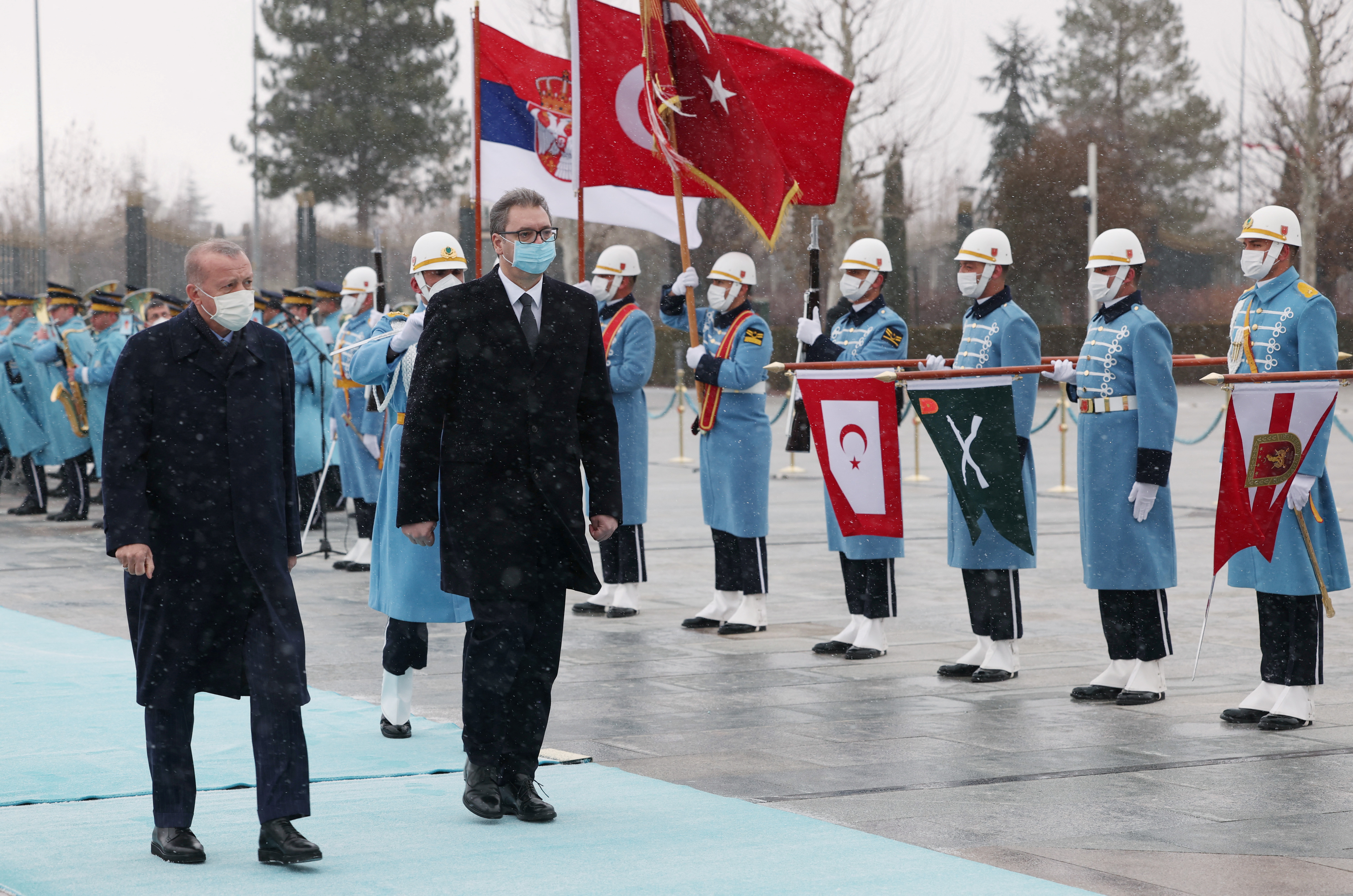 Turkish President Tayyip Erdogan and Serbian President Aleksandar Vucic review a guard of honour during a welcome ceremony in Ankara