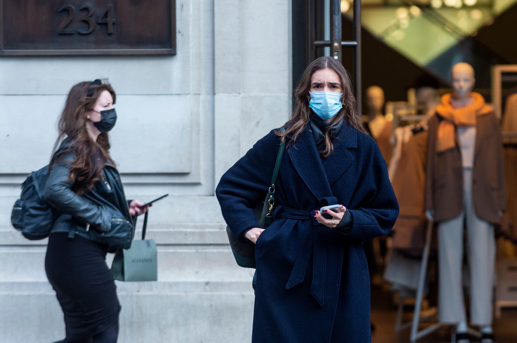 London, UK.  27 January 2022.  Shoppers wearing facemasks in Regent Street. The UK government has relaxed Plan B restrictions put in place to combat the rise of the Omicron variant. Facemasks remain a condition of travel on the TFL network, some shops con