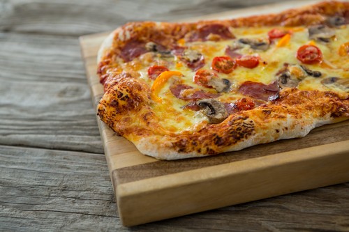 Italian pizza served on a chopping board