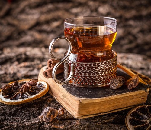 Glass cup of black tea