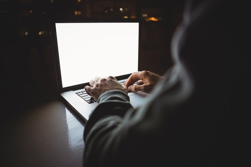 Hacker using a laptop