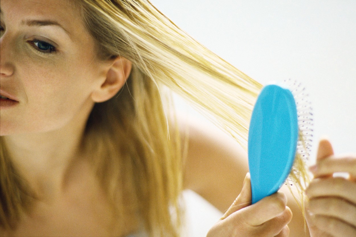 Woman brushing hair