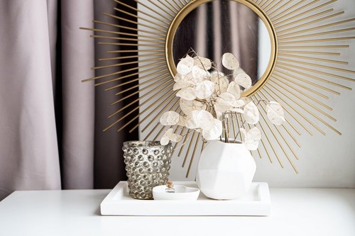 Beautiful white home interior decoration with vases and mirror