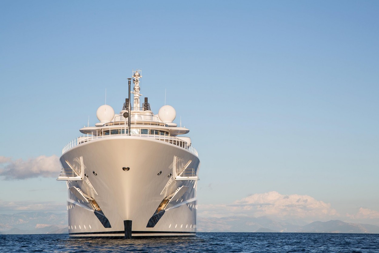 Gigantic big and large luxury mega or super motor yacht on the blue ocean.