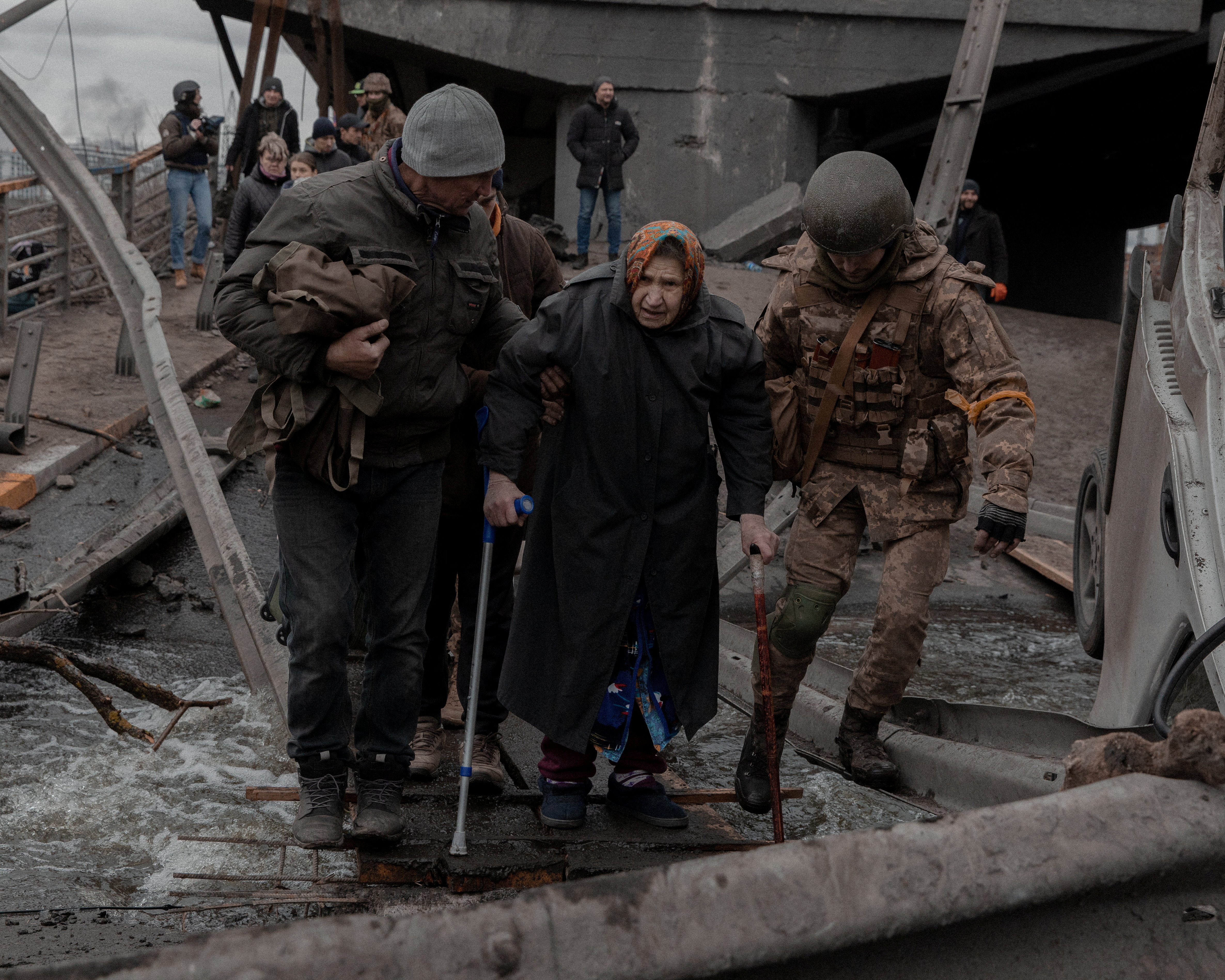People flee from the city of Irpin in Kyiv region