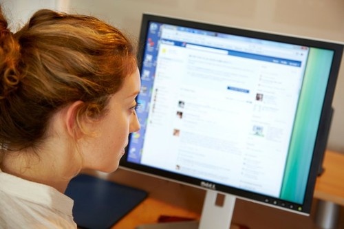 Woman using Facebook