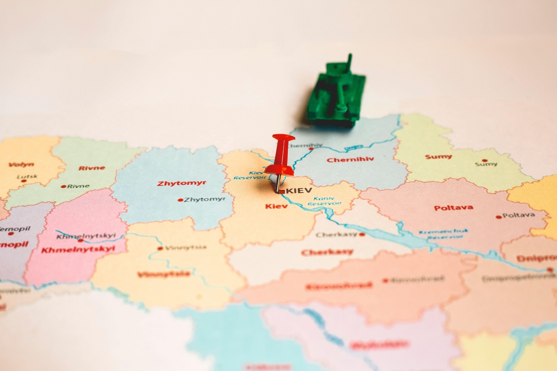 Russian invasion of Ukraine concept of war conflict .tanks on a map of ukraine , war representation