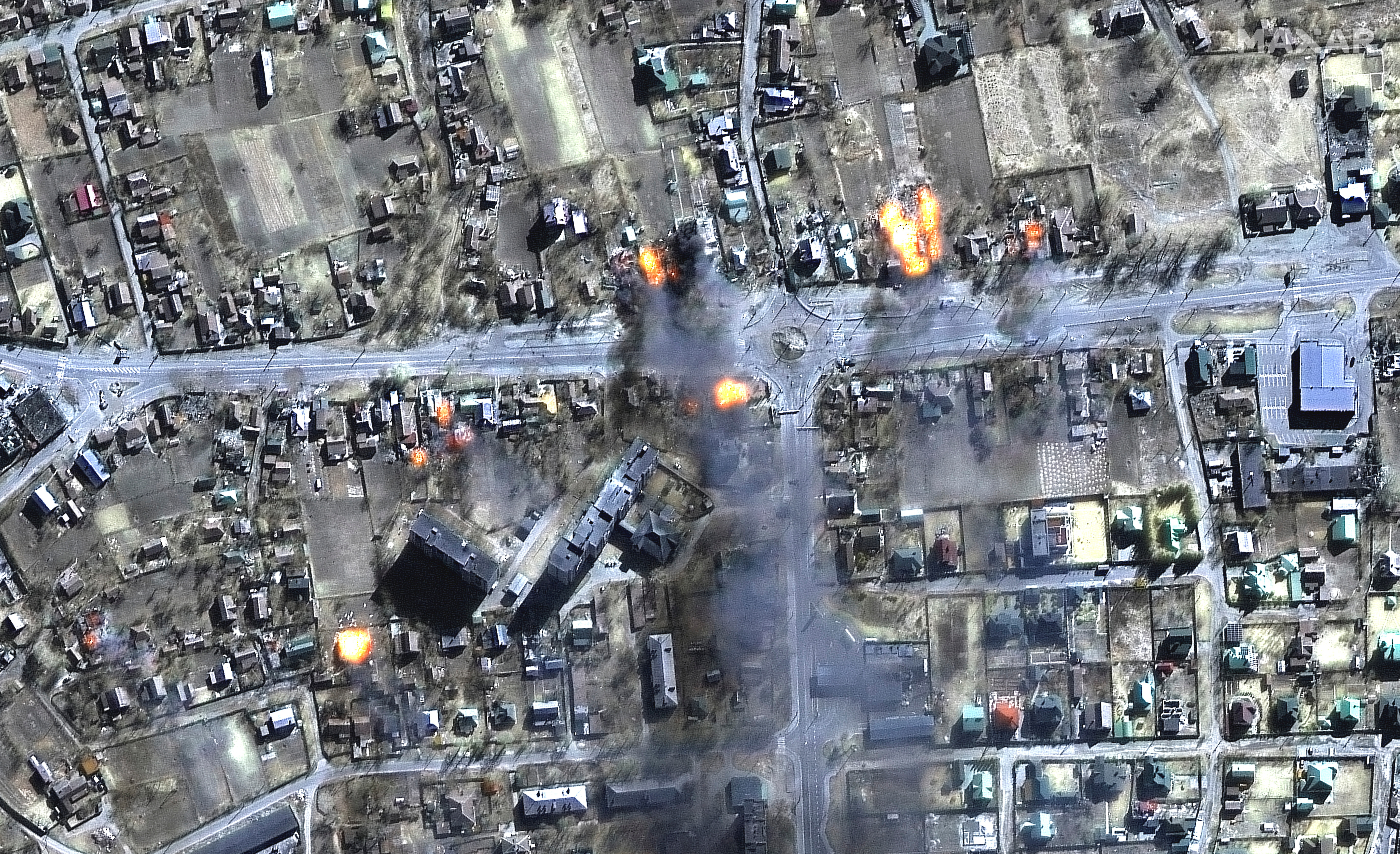 A satellite image shows a close up of burning homes and a residential area, northeast Chernihiv