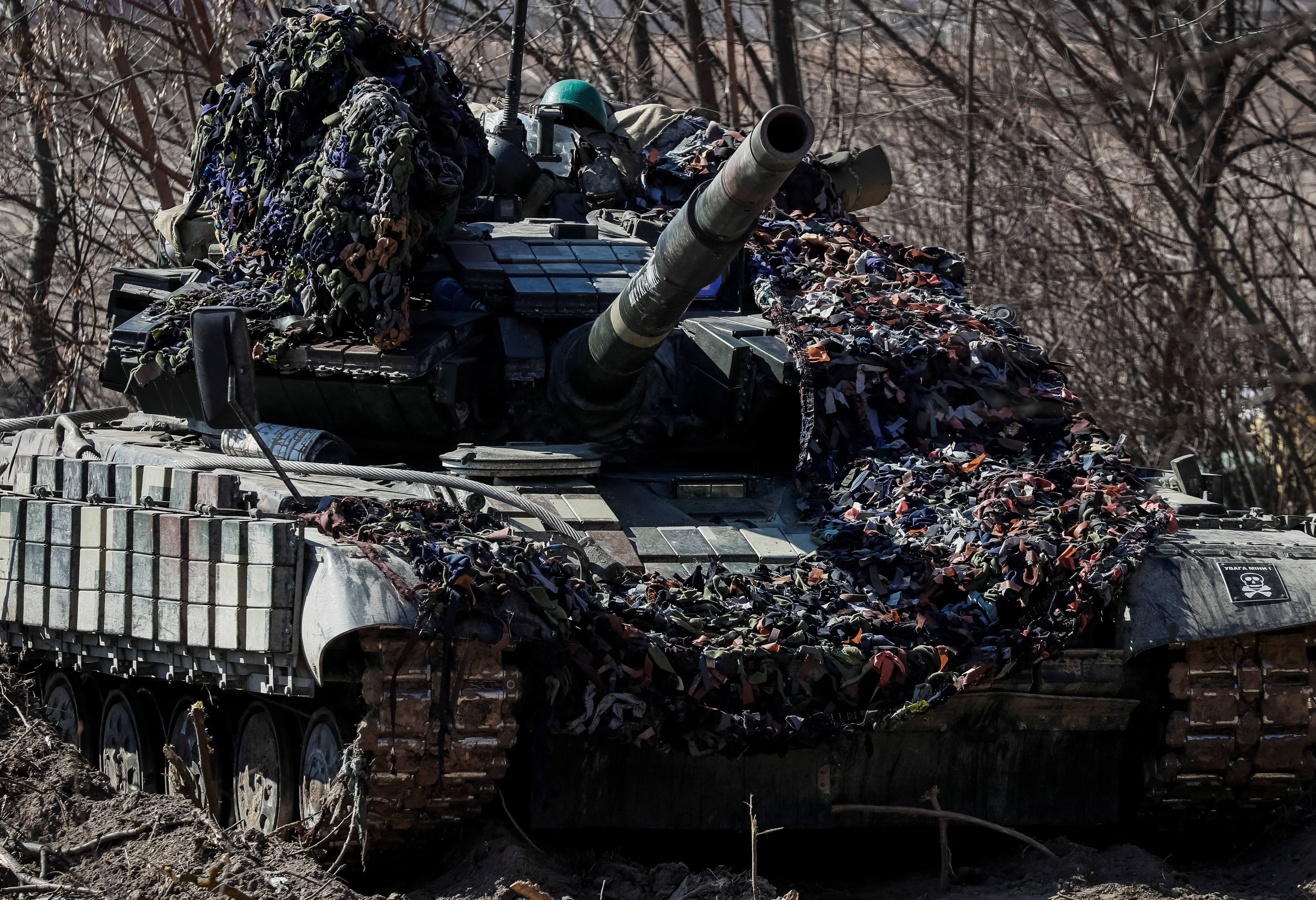 A Ukrainian tank is seen at a position on the front line in the east Kyiv region