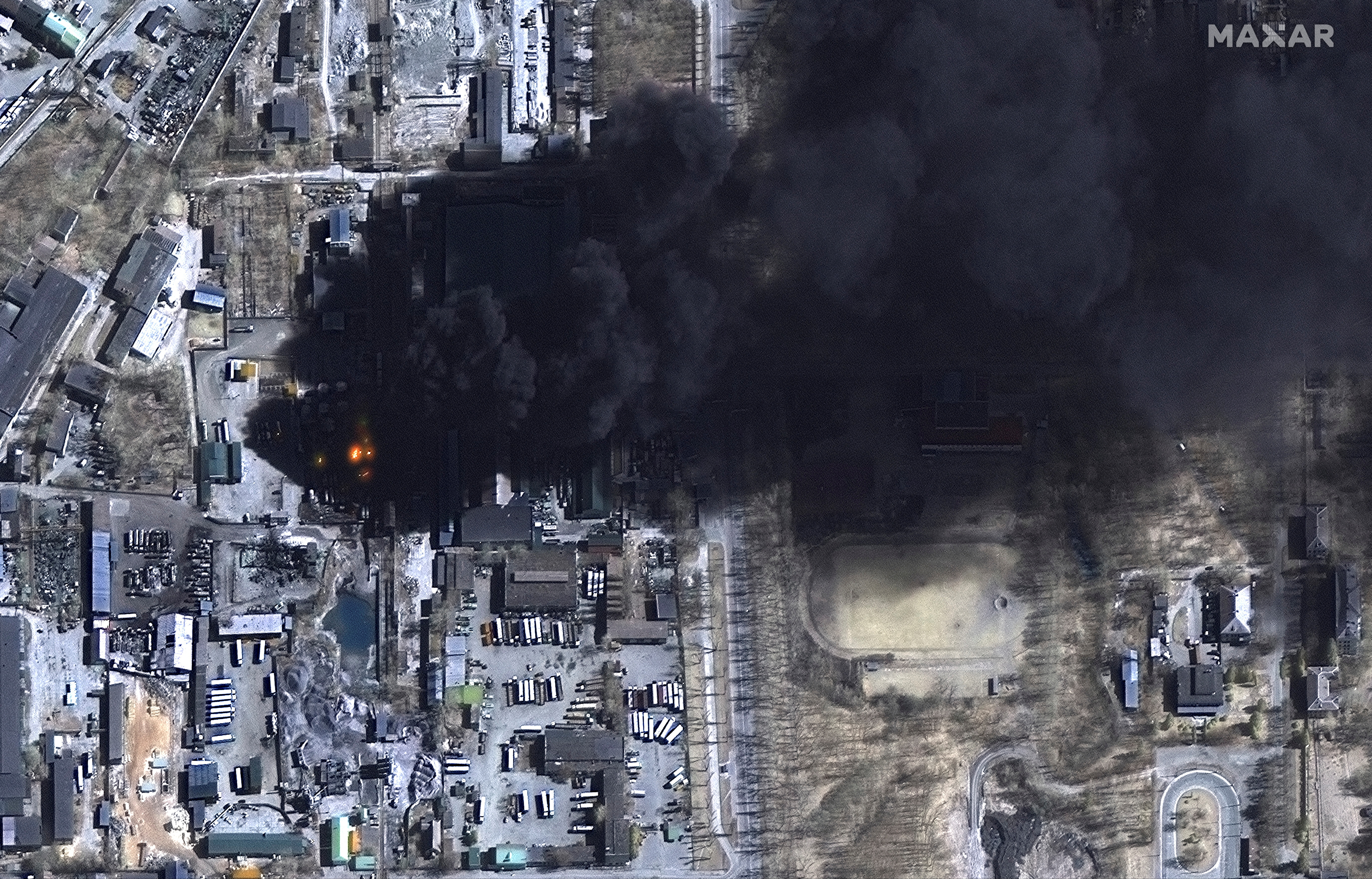 A satellite image shows closer multispectral image of burning oil storage tanks in Chernihiv