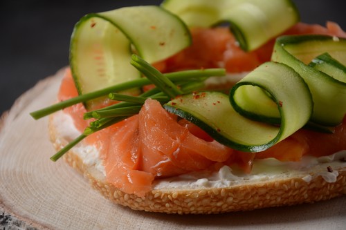 Bagel sandwich with salmon, cream cheese, cucumber