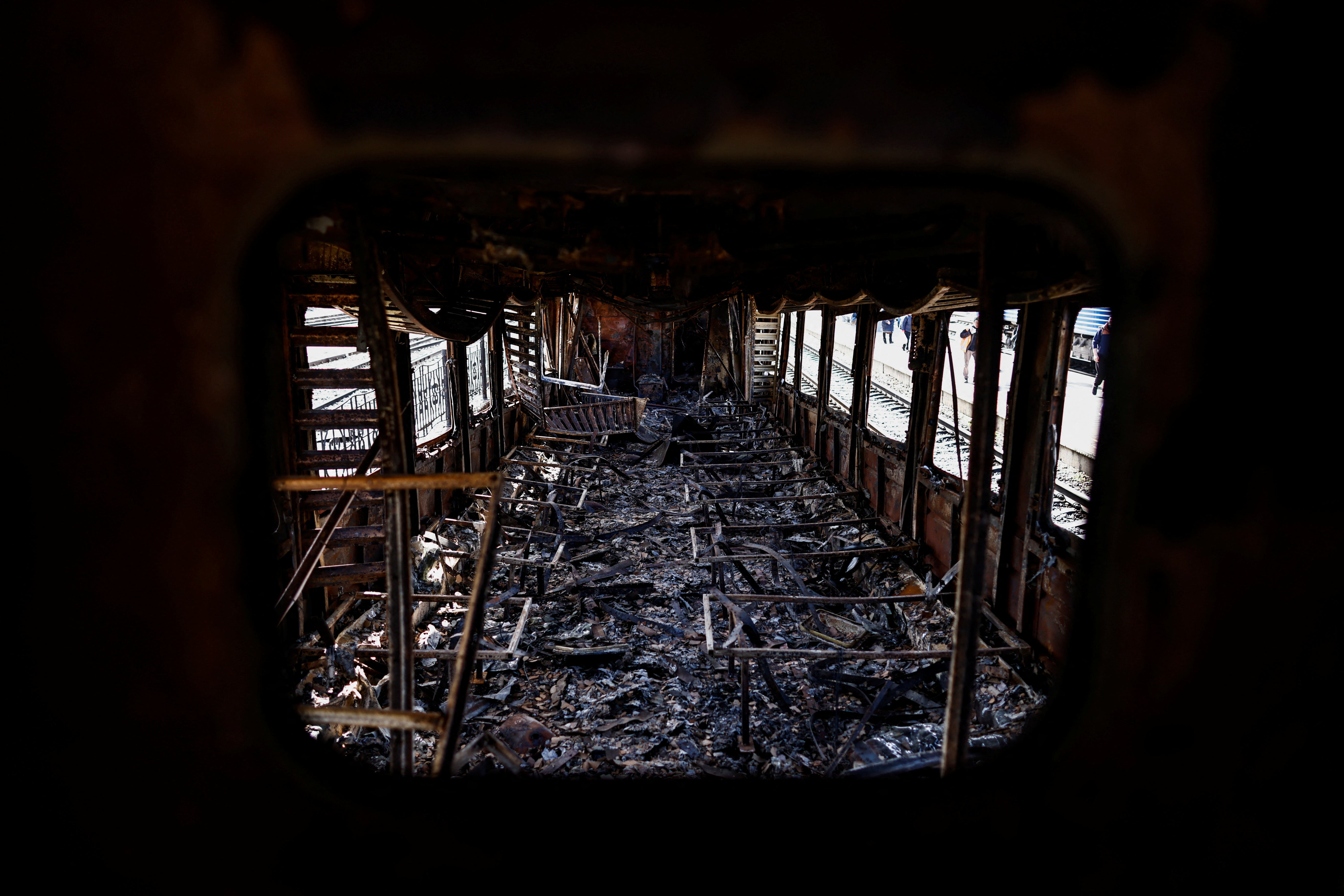 A destroyed train, which according to residents was destroyed by shelling is seen at the train station, amid Russia's invasion of Ukraine, in Trostianets, Sumy region