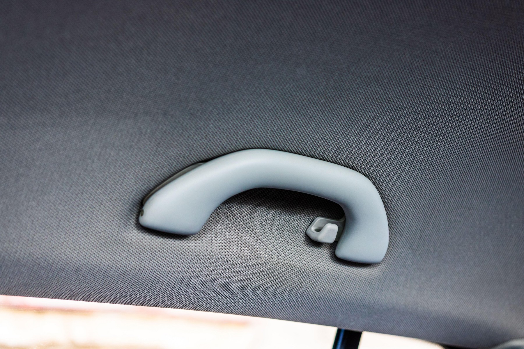 Close up photo inside a car, roof handle isolated.