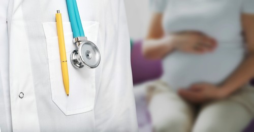 Pregnancy consultation, conceptual image