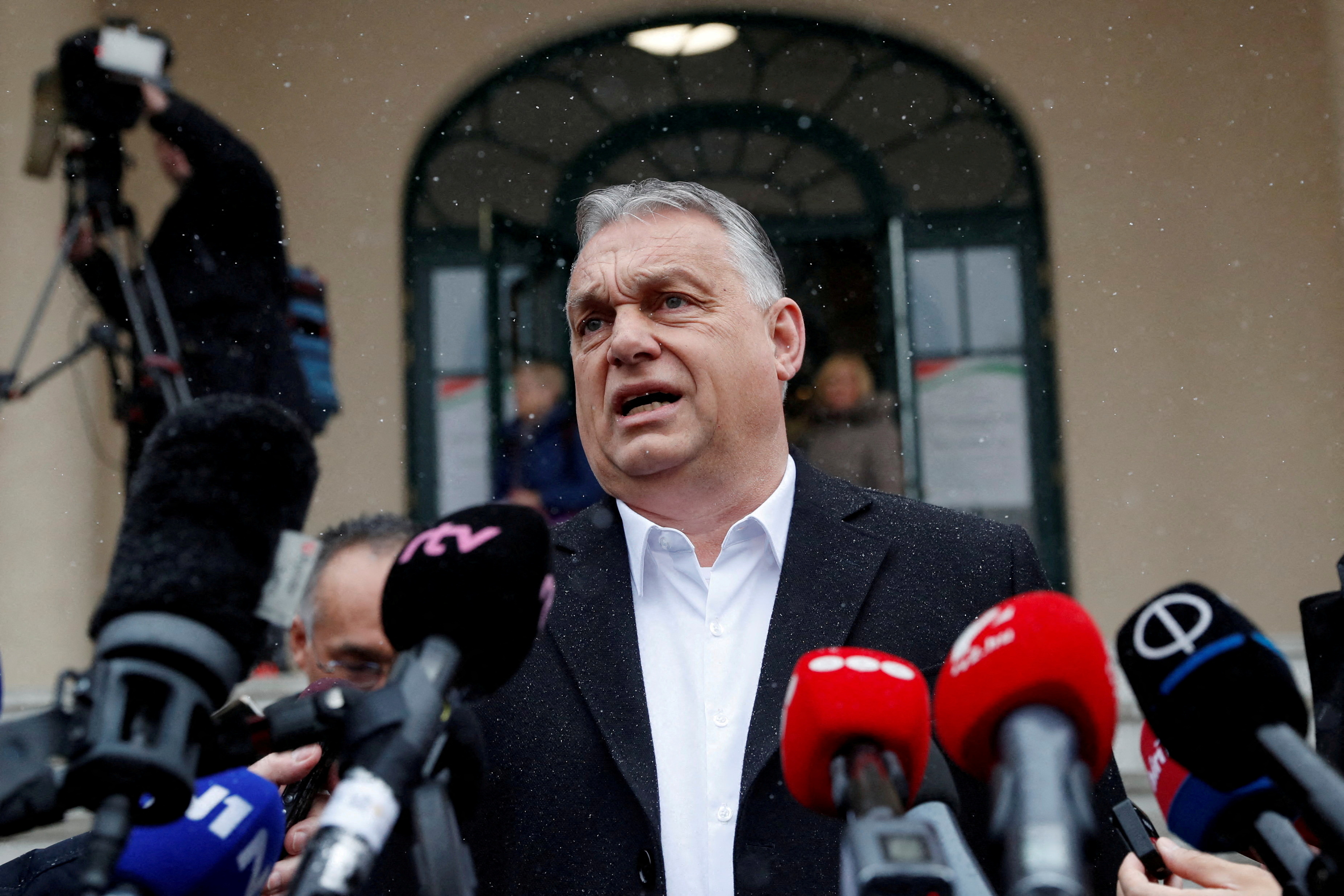 FILE PHOTO: Hungarian Prime Minister Viktor Orban gives a statement to the media after leaving a polling station during Hungarian parliamentary election in Budapest, Hungary, April 3, 2022