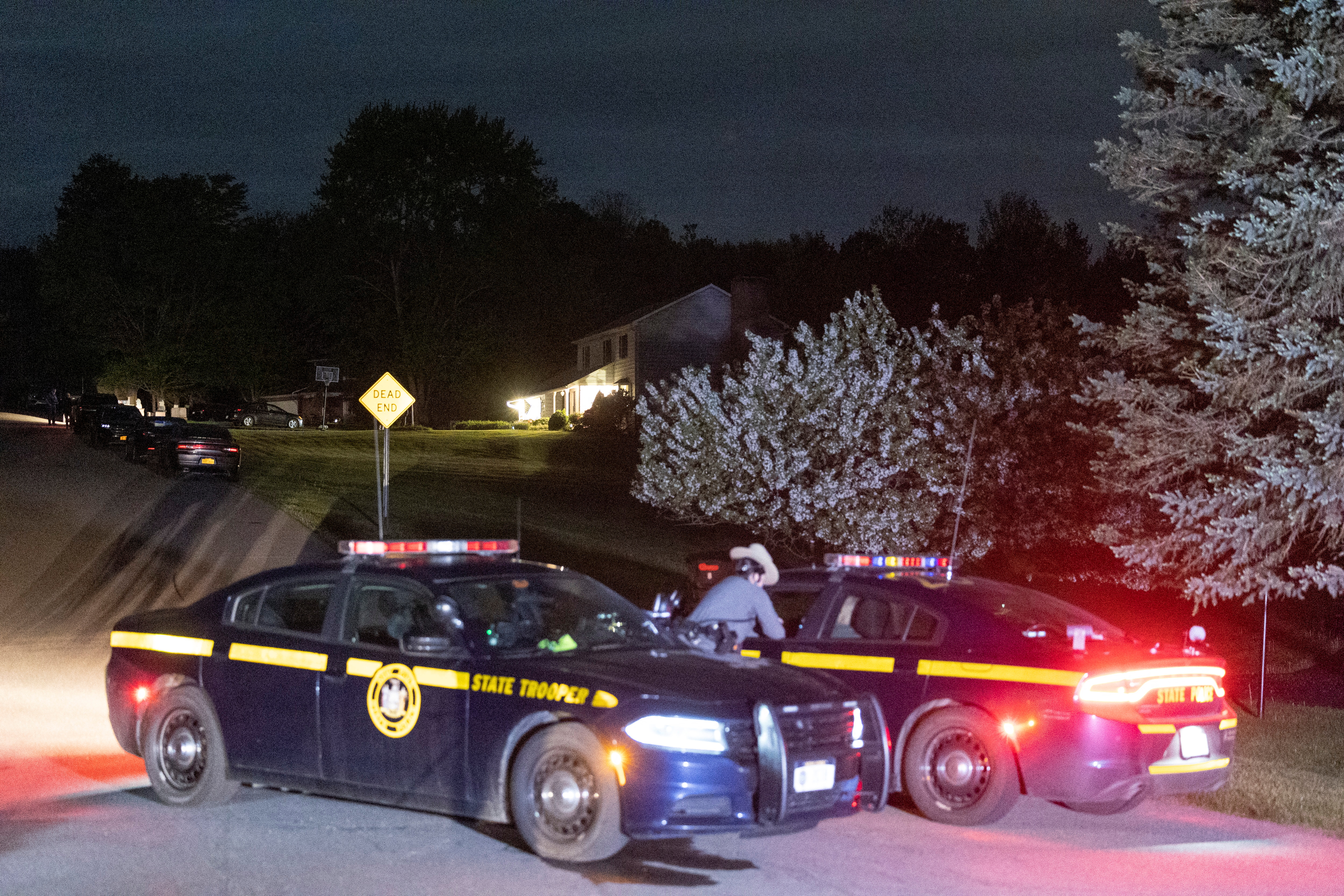 Law enforcement personnel are seen at the home of Buffalo supermarket shooting suspect, in Conklin