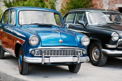 Podol, Ukraine - May 19, 2016: Classic soviet retro city car MZMA Moskvitch 407 and GAZ M 21 Volga