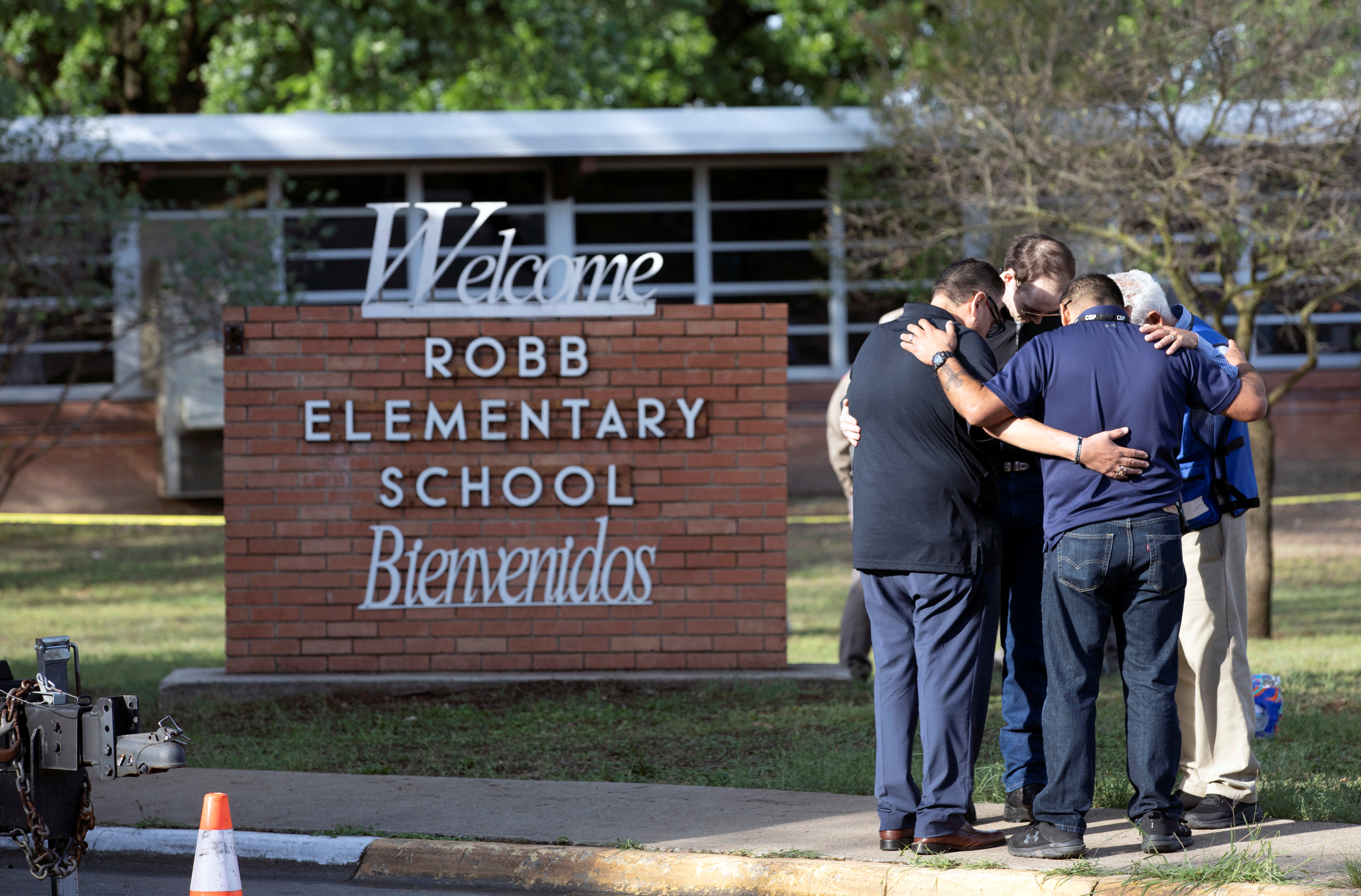 People react after a mass shooting at Robb Elementary School in Uvalde
