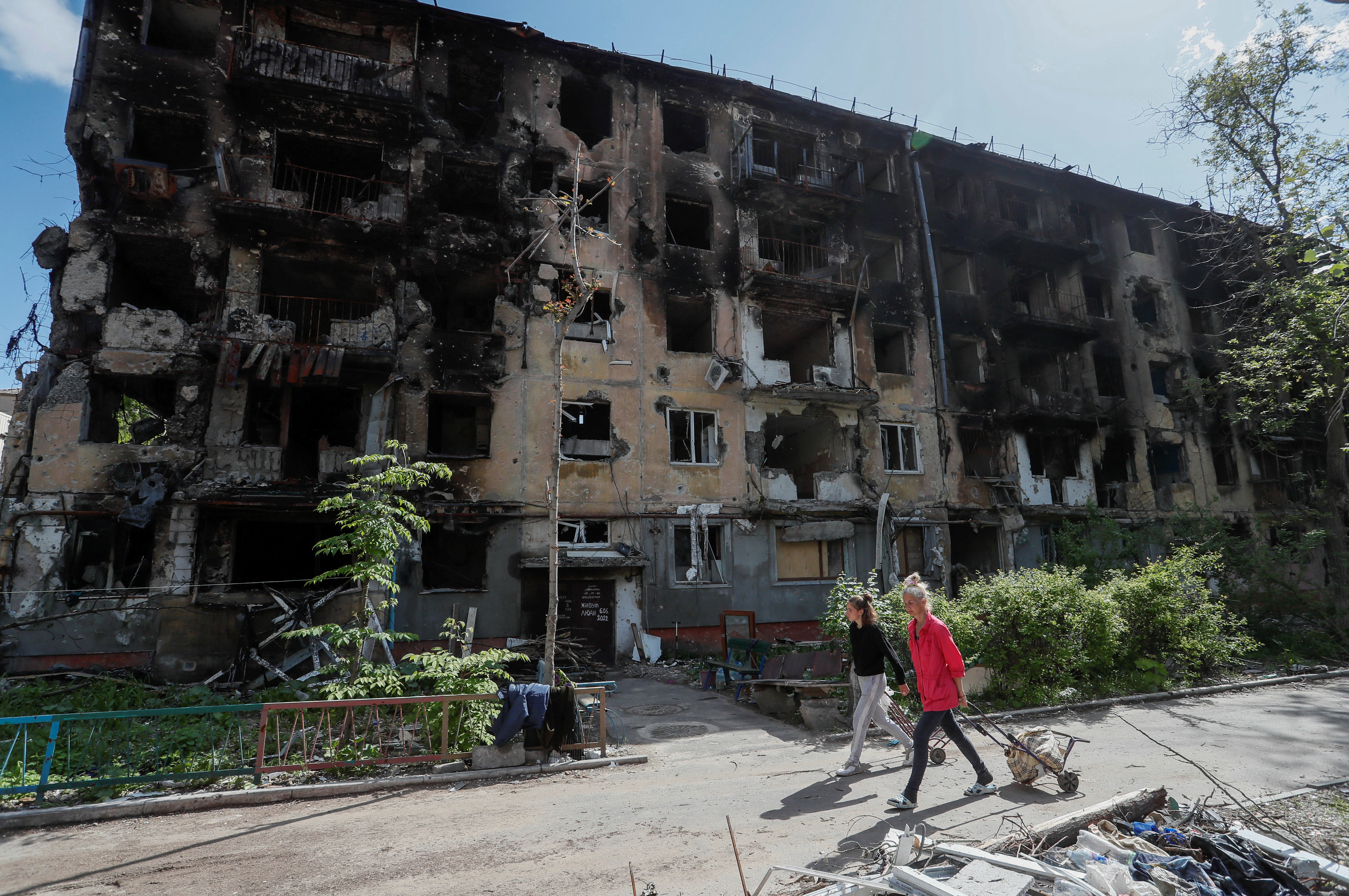 A view shows a damaged building in Mariupol