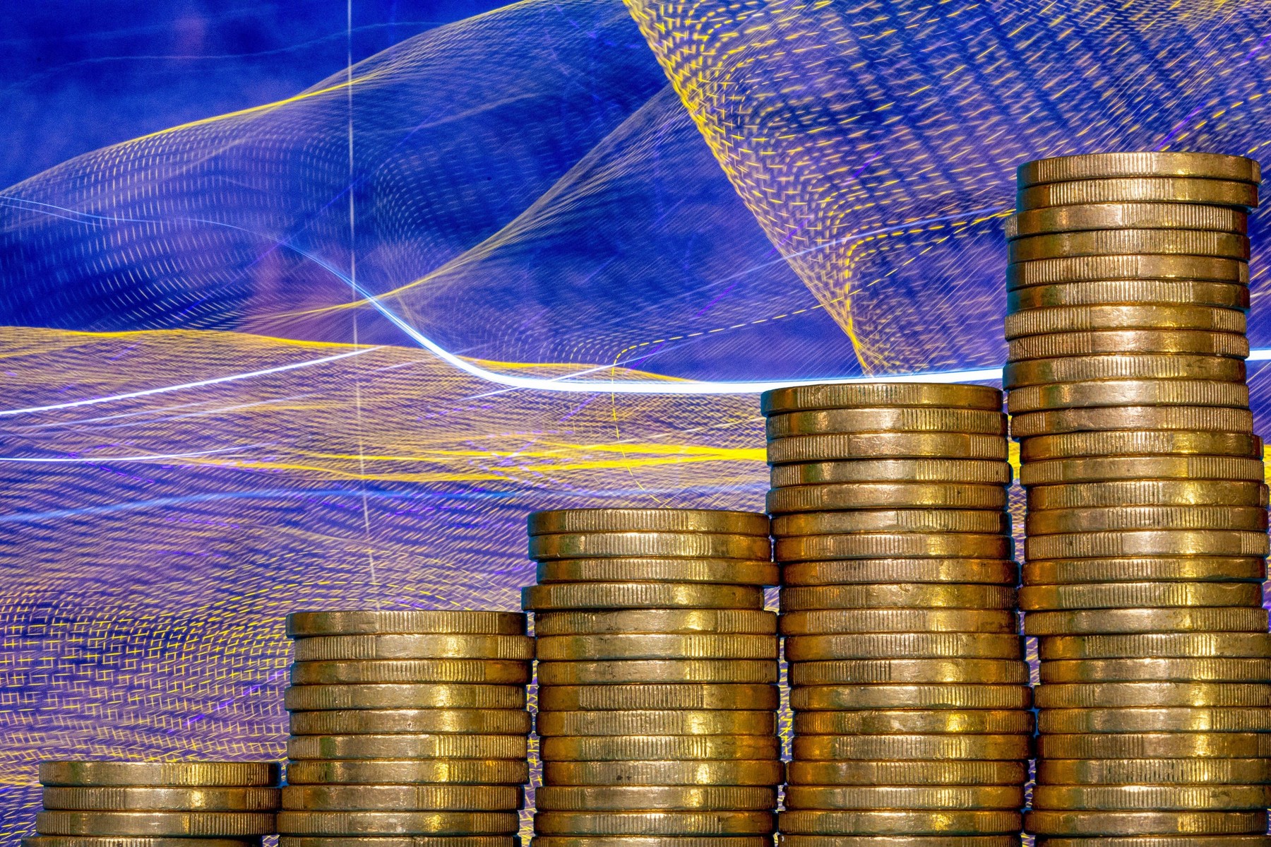 Stacked one-euro coins as a symbolic image for finance, inflation, etc.