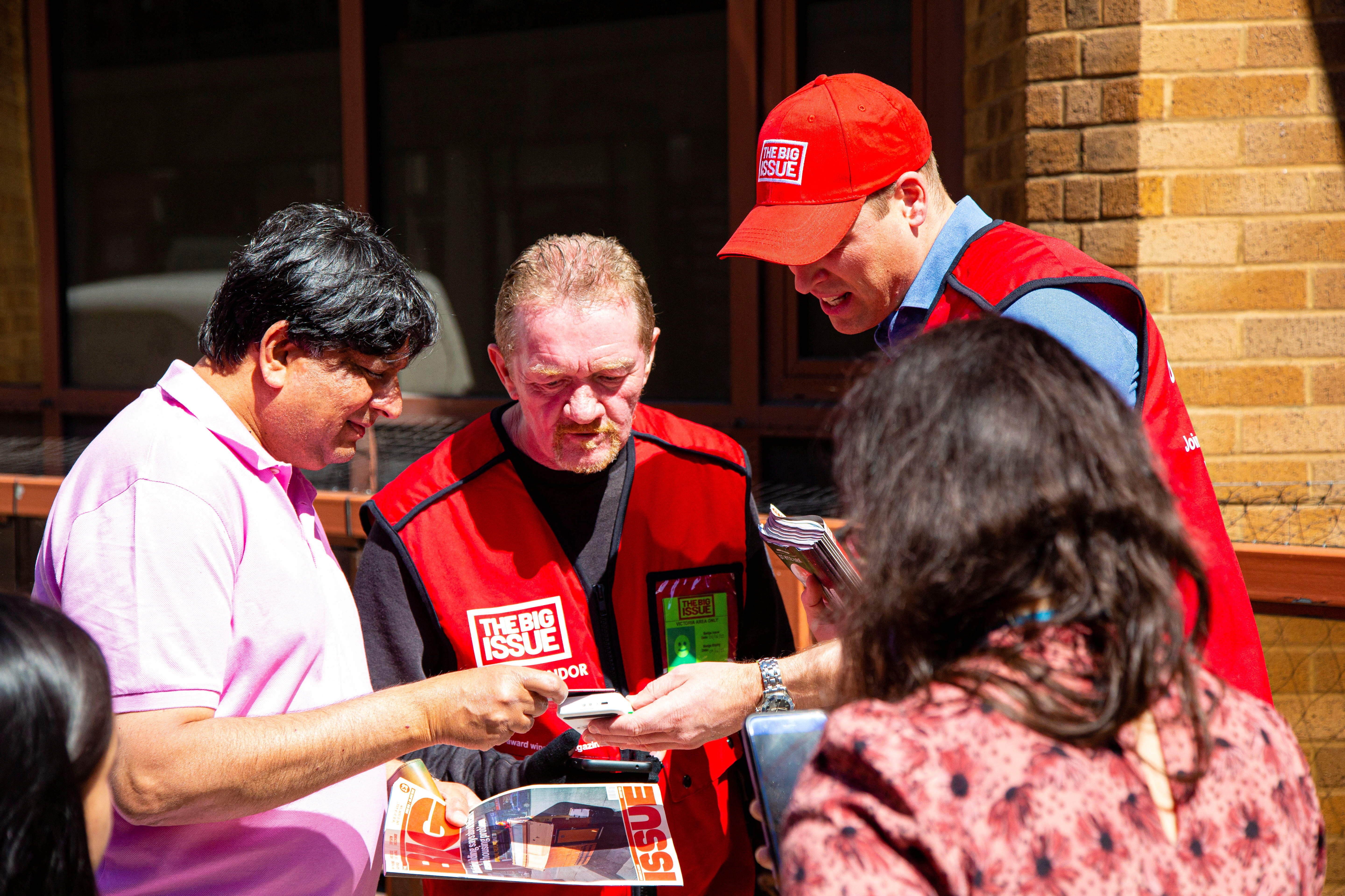Britain's Prince William works as a vendor of The Big Issue newspaper