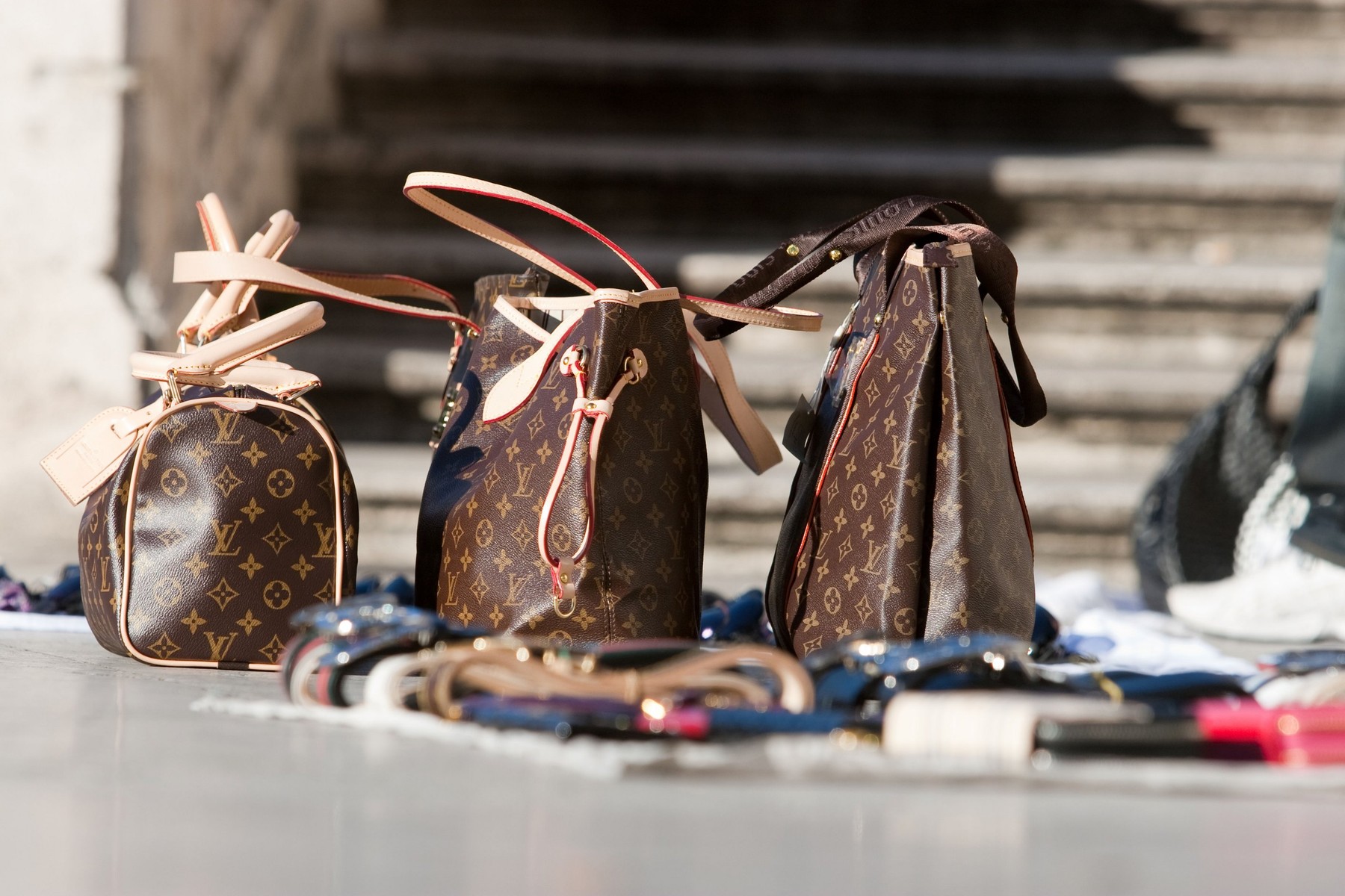 Design goods fake for sale in Trinit dei Monti steps Rome Italy.