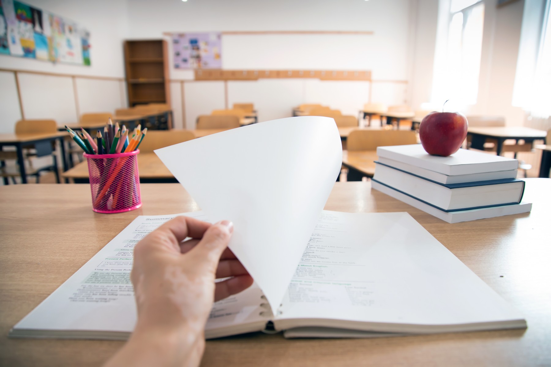Pencils and books in the classroom. Education concept.