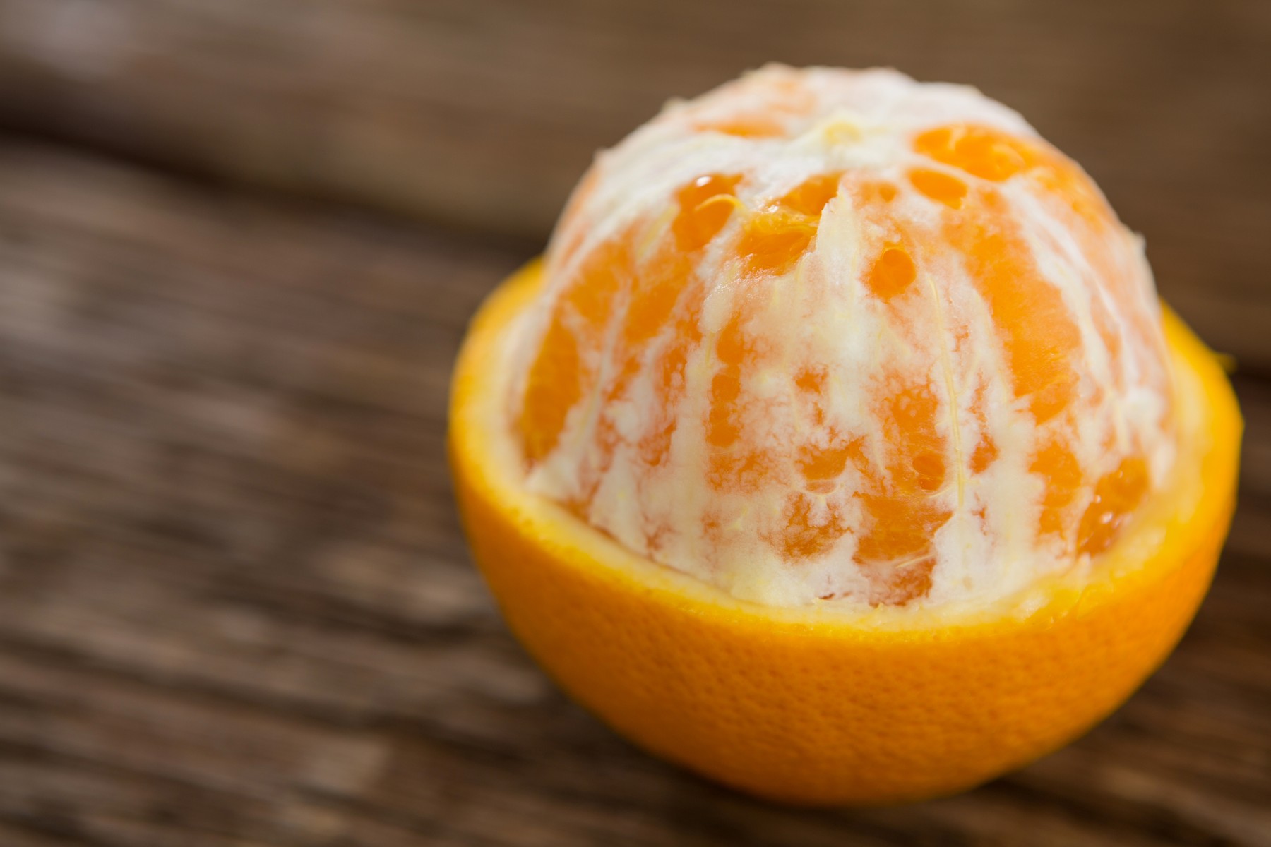 Close-up of half peel orange