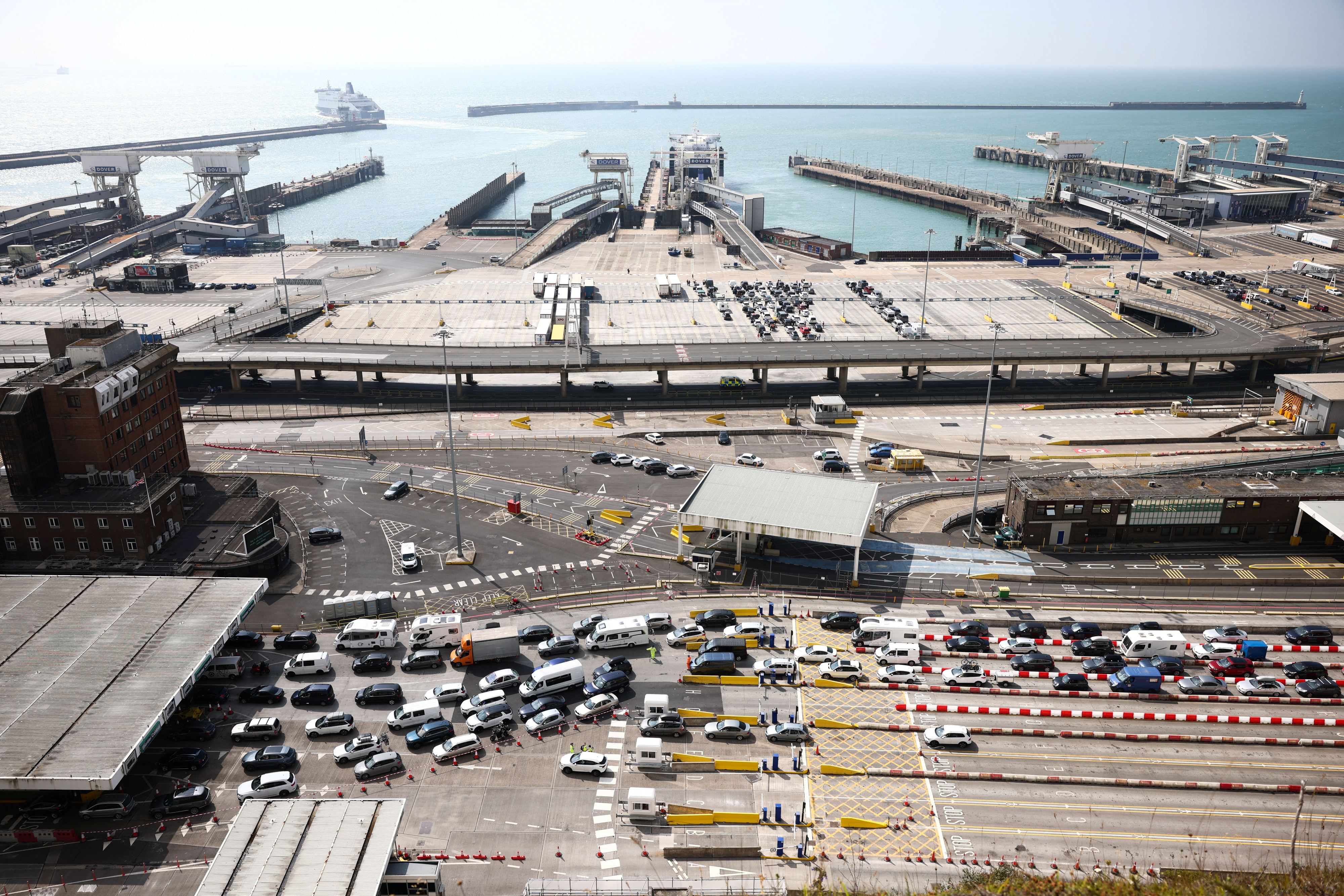 Vehicles queue at the border control booths at the Port of Dover