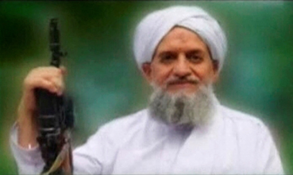 FILE PHOTO: A photo of Al Qaeda leader Ayman al-Zawahiri is seen in this still image taken from a video