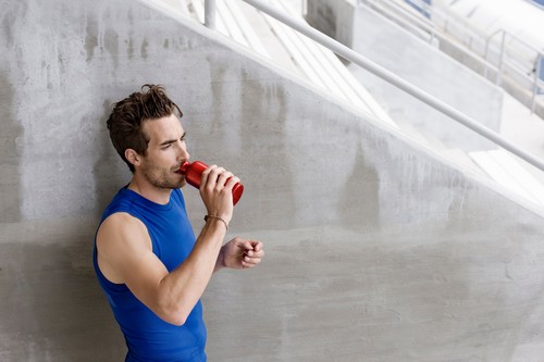 Runner drinking water