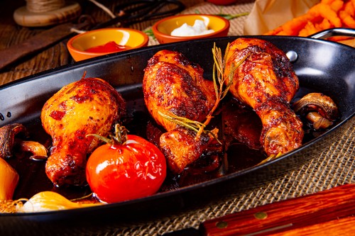 grilled chicken legs in barbecue marinade with sweet potatoes