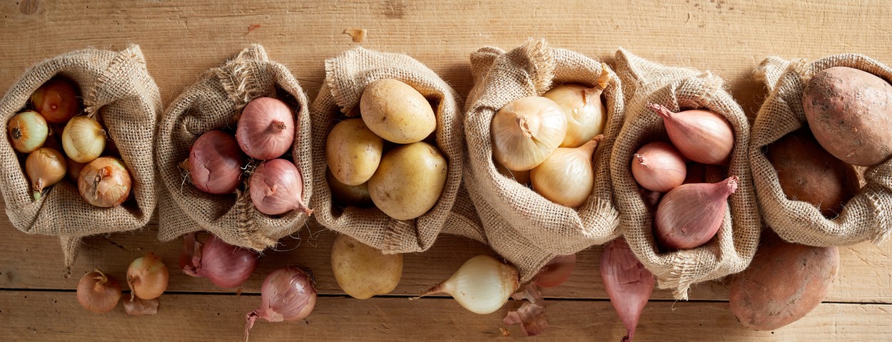 Top view of onion and potatoes in sack bags