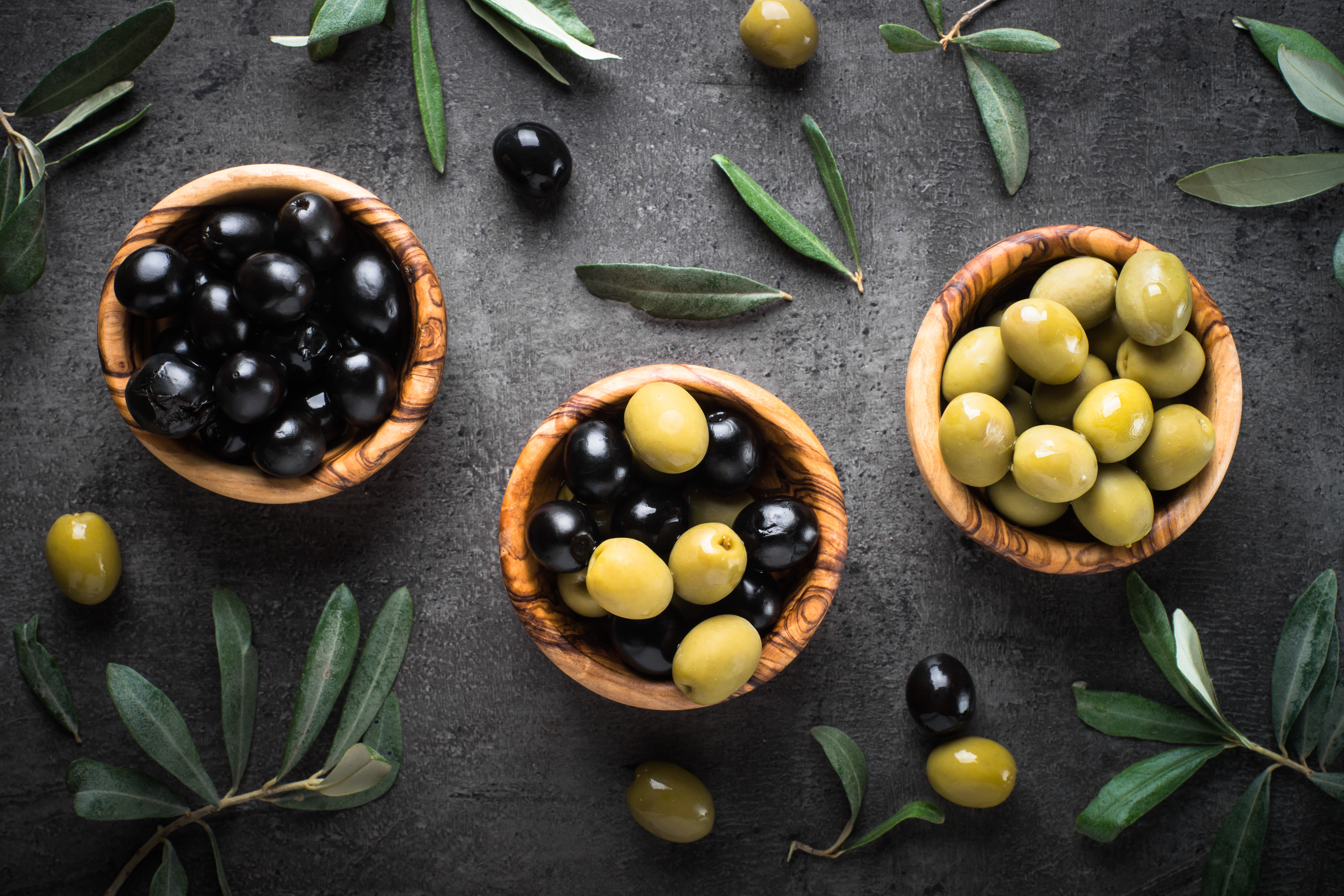 Black,And,Green,Olives,In,Wooden,Bowls.,Top,View,On