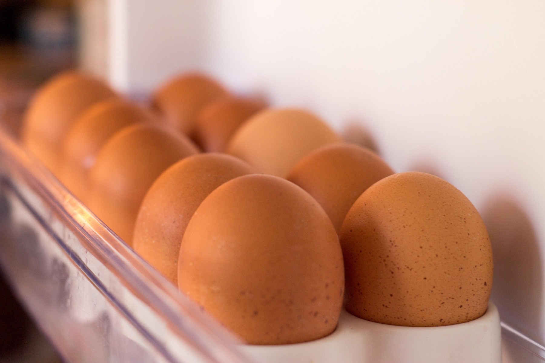 Packing eggs in a cardboard box. Eggs in the fridge.
