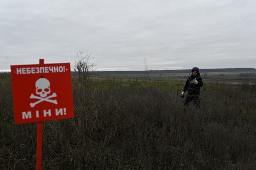 Ukraine: Bomb disposal technicians of the Ukrainian Department of Emergency Services remove and disarm anti-tank mines in the fields South of the city of Izyum