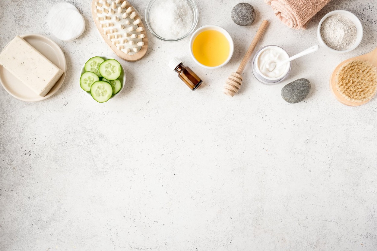 Natural Spa Background, copy space, flat lay. Organic spa cosmetic products and natural skincare concept on white.