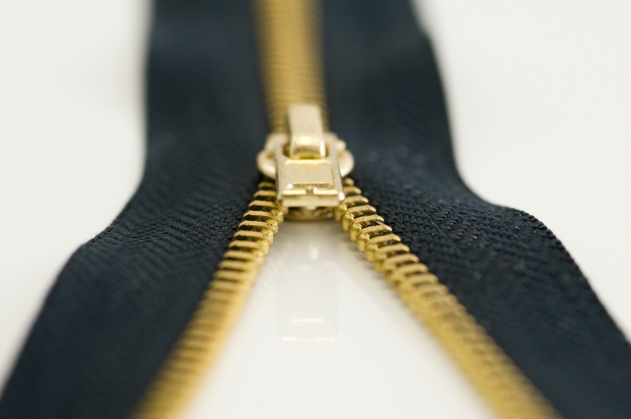 a zipper on a white surface