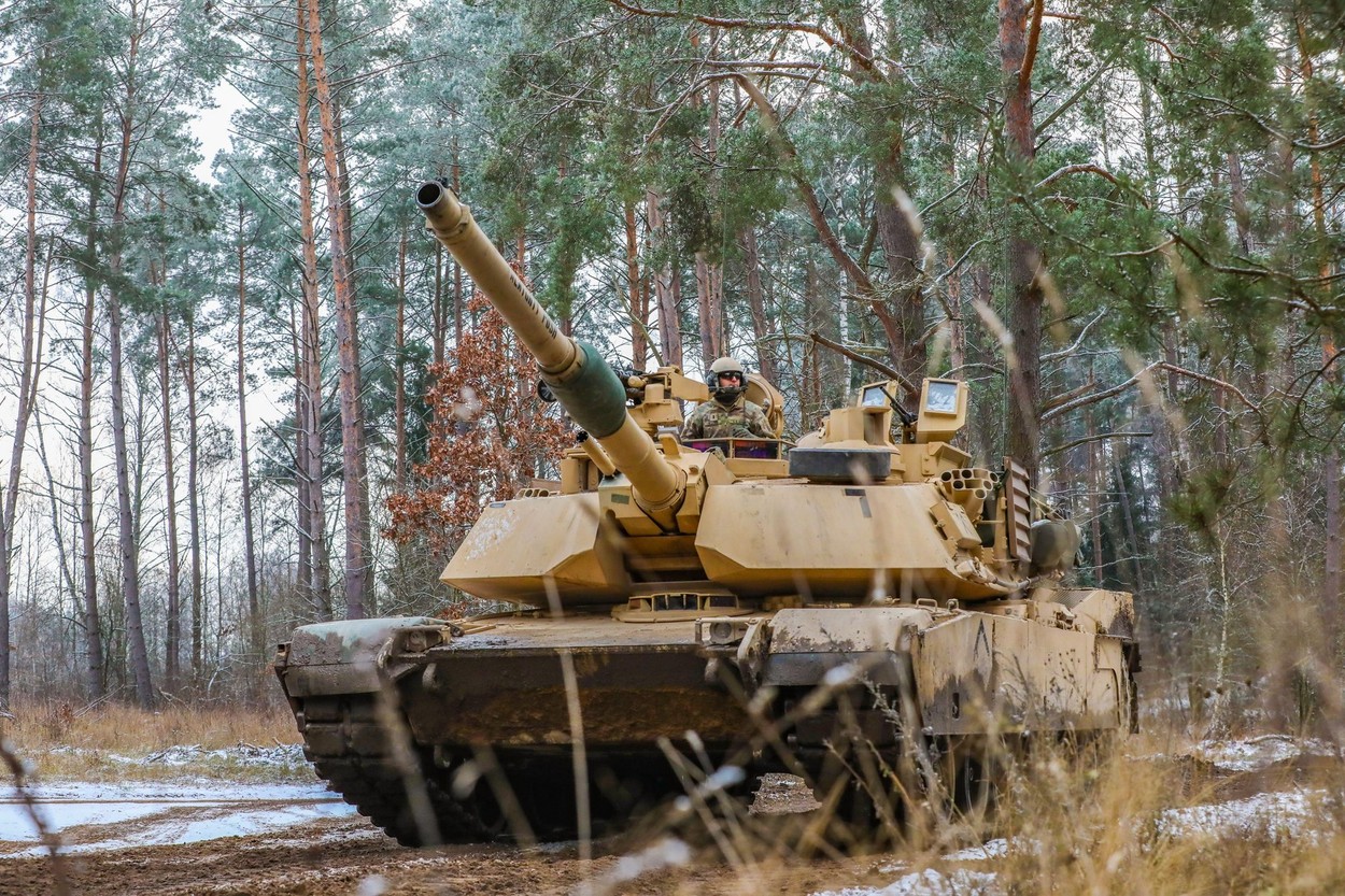 U.S. Soldiers assigned to Alpha Company 3rd Battalion, 8th Cavalry Regiment, 3rd Armored Brigade Combat Team, 1st Cavalry Division (3-1 ABCT) operationally controlled by the 1st Infantry Division (1 ID), operate a M1A1 Abrams to engage a simulated opposin