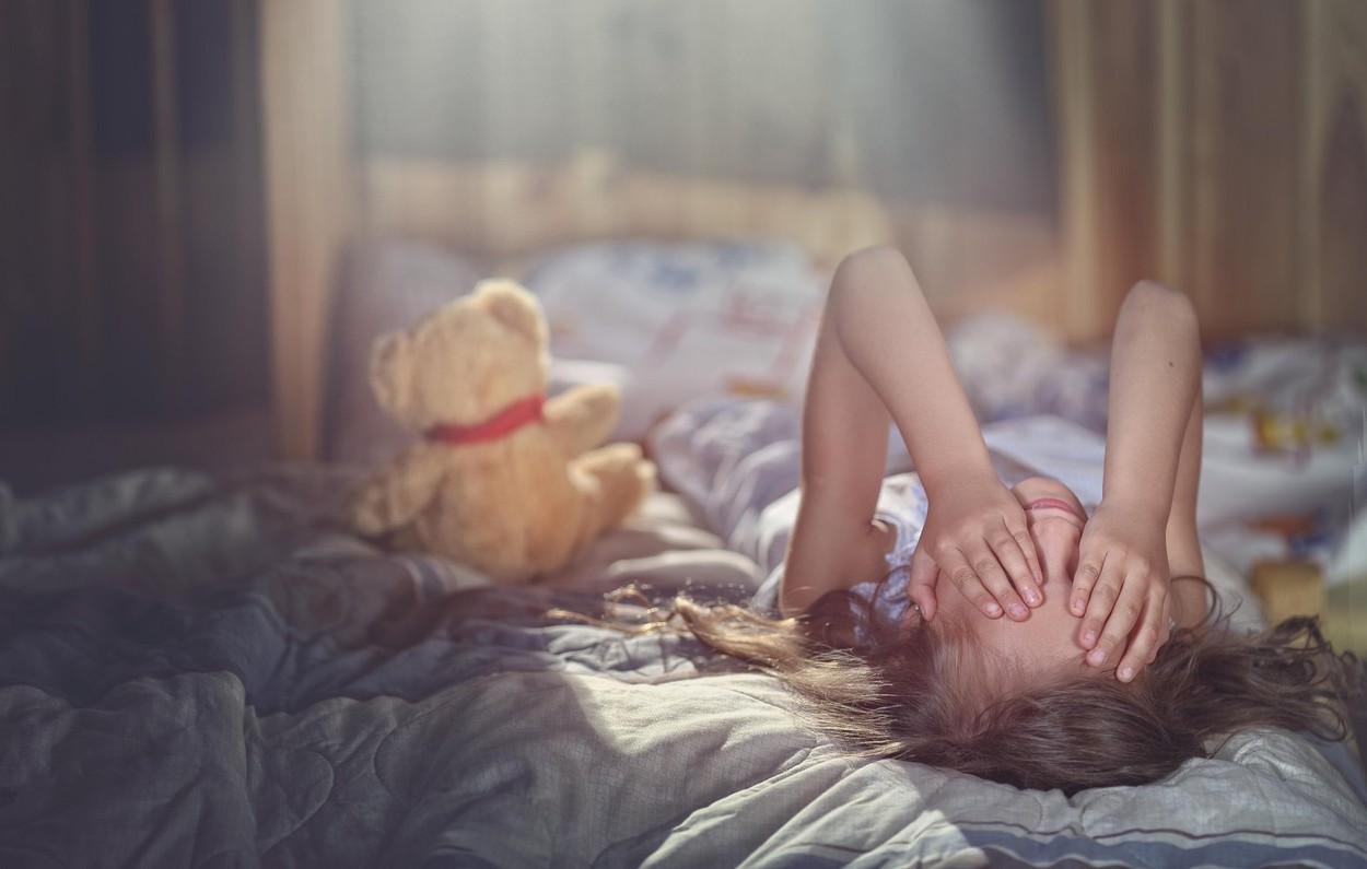 Lonely little child crying in the room