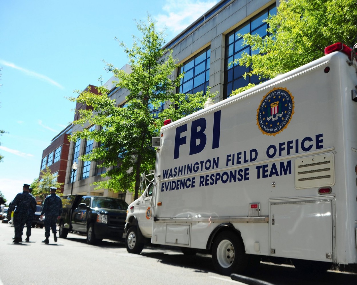 An FBI evidence response team collects evidence at Building 197 at the Washington Navy Yard. A gunman killed 12 people at the base Sept. 16, 2013.