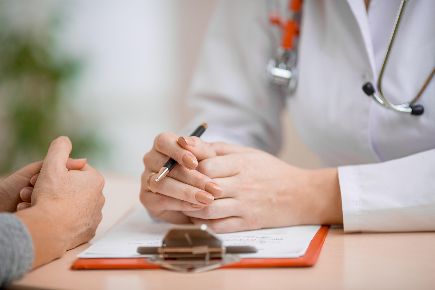 Doctor consulting patient in office
